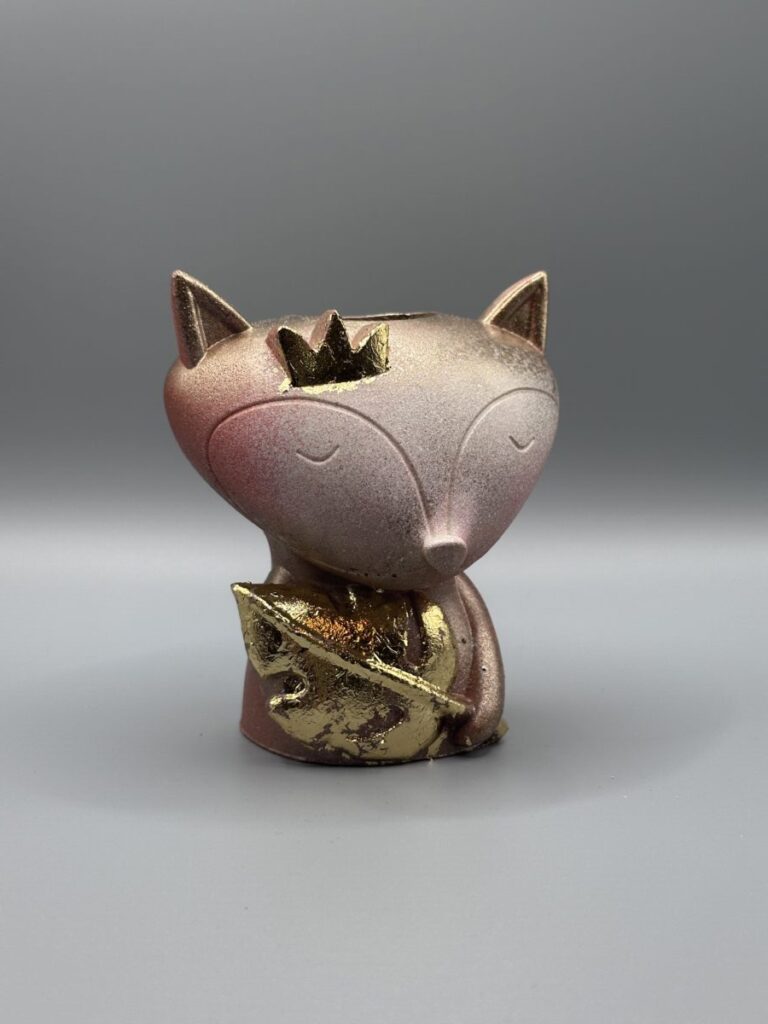 Meet "The Royal Vulpine" at Boba's Plant. This charming fox planter features a golden crown and leaf detail with a warm sunset texture. Perfect for small succulents and nursery decor!