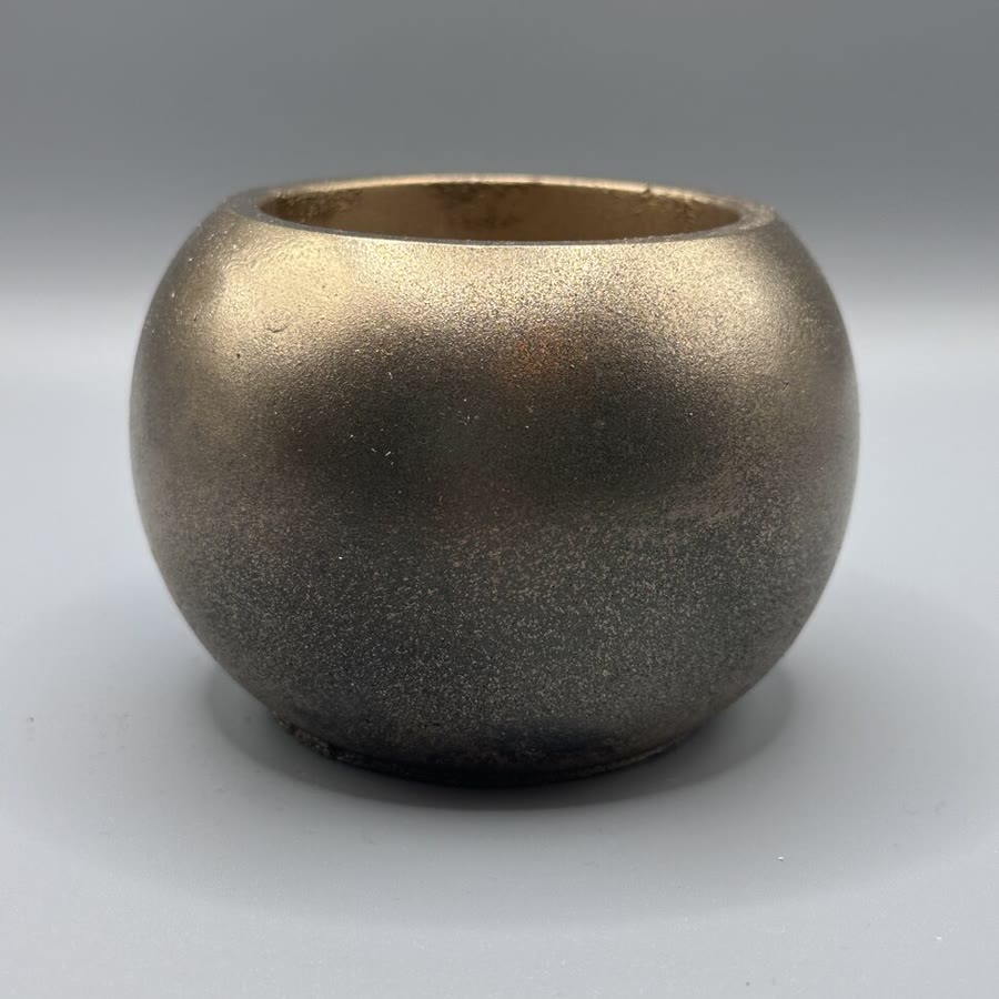 Handmade round bronze sphere planter — the previous campaign gift
